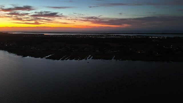 4k drone scene of rays of the River Murray Sunset over Goolwa at sunset in South Australia