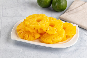 Sweet canned pineapple slices in syrope
