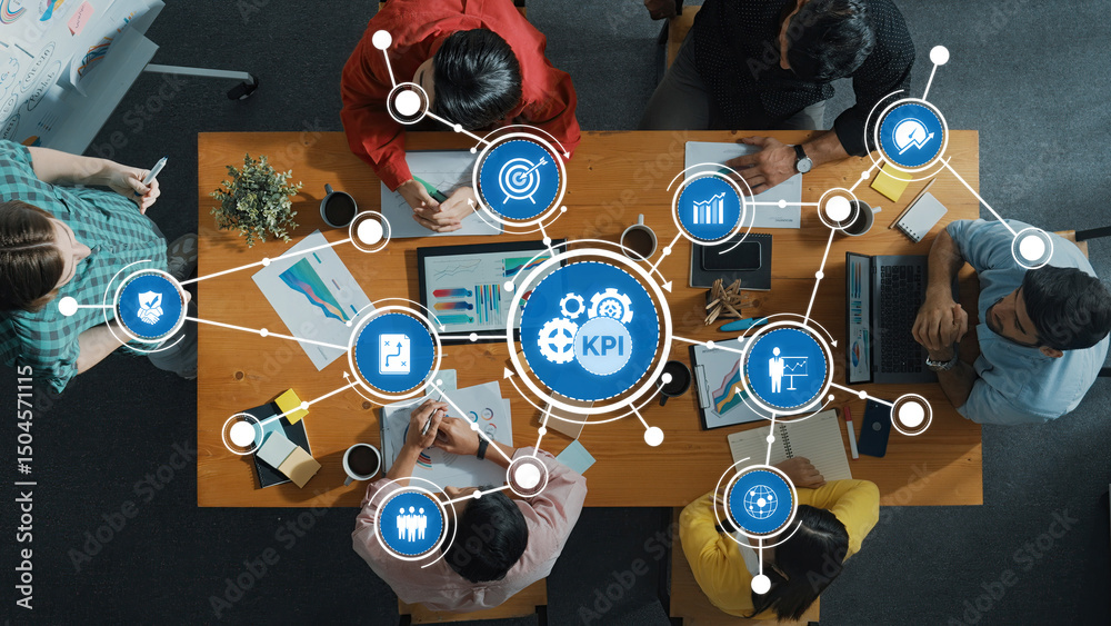 Poster a diverse business team collaborates around a table analyzing key performance indicators with visual