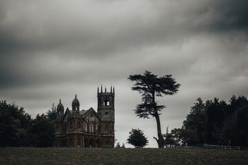 gothic temple atop a hill in a scenic country park in England