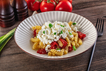 Italian pasta fusili with curd