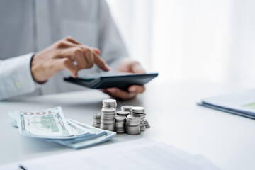 Close up of hand using calculator calculating personal finance for income and expenses