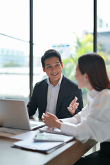 Corporate employee in Asia supervising mentor session for trainee in office with teamwork and...