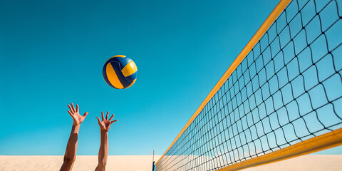 Beach volleyball game with net and ball under clear blue sky day