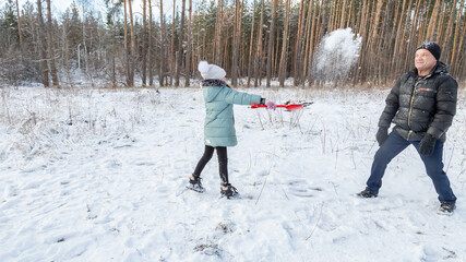 snowball fight in snowy winter park