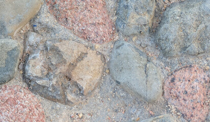 Full frame Nature background of old gray road stone pavement, close up organic black stone texture for wall, abstract photo for interior or exterior design of large cobblestones, abstract backdrop