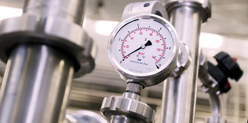 Pressure gauge indicates measurement on industrial pipelines in a facility