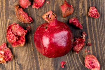 red ripe pomegranate on a table, sweet red pomegranate in the kitchen