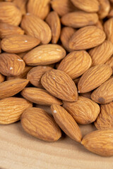 almonds on the table, ready-to-eat almond nuts on a wooden table, closeup