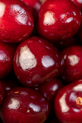 ripe red cherry berries , red cherry fruits on the kitchen table closeup
