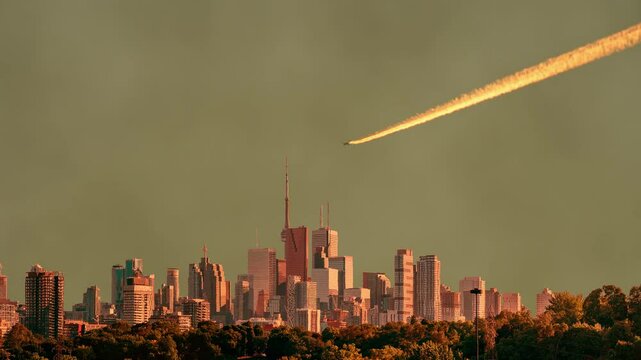 Plane in the sky release chemtrail consisting of chemical and biological agents over Toronto, Ontario, Canada. Artistic collage vision, special effects, shivering air and dirty black white mist smog.