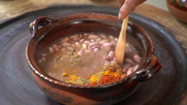Adding Colorful Spices To A Bowl With Beans For Tasty Cooking