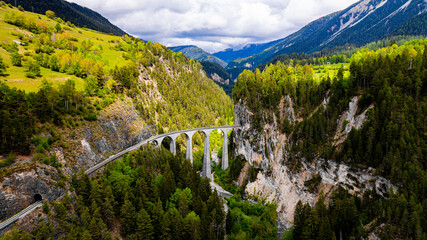 the famous swiss landwasser bridge of the rhaetische railway company