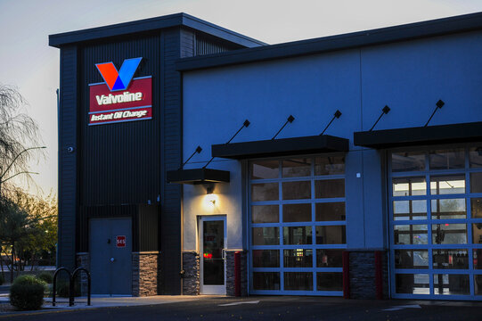 A Valvoline Instant Oil Change facility with illuminated signage and service bays illustrates drive-through automotive maintenance operations and branded fast-service oil change infrastructure