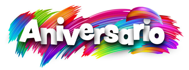 Spanish word meaning anniversary in bold white letters over vibrant multicolor vector brush strokes