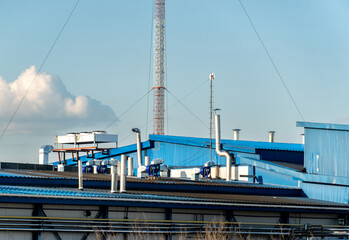 Industrial Building Rooftop with Ventilation System and a Communication Tower