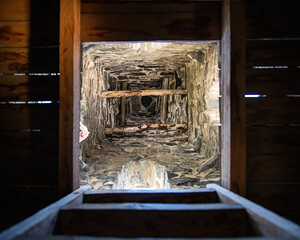 medieval tower Stone tunnel interior. Looking up through a stone shaft. Top view into stone well.