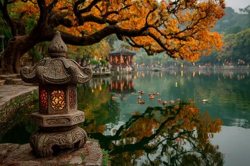 Fototapeta premium Autumn Serenity A Stone Lantern Illuminates a Tranquil Pond with Falling Leaves and Reflection