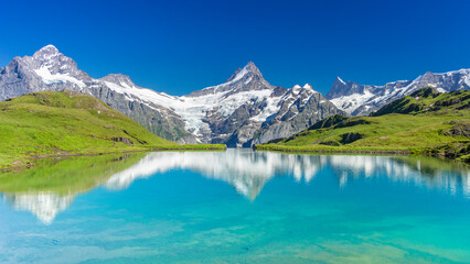 Crystal Clear Alpine Lake with Swiss Mountain Reflections