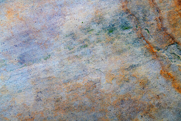 Rough stone texture in warm earthy tones.