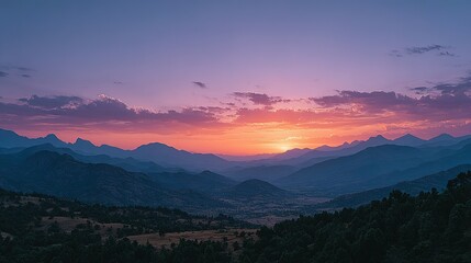 Fototapeta premium A vast mountain range at sunset, vibrant colors.