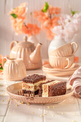 Tasty sponge cake with fluffy cream layer and glaze.
