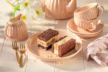 Sweet sponge cake with glaze and cream layer.