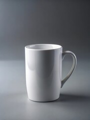 Obraz premium Simple white ceramic mug on a plain gray background