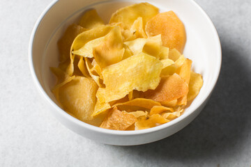 Overhead view of golden sweet potato chips, top view of crispy fried sweet potato chips