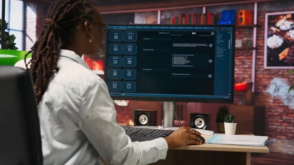 Woman solving personal tasks with AI LLM chatbot answering prompts using predictive technology. Person using computer in apartment to interact with large language model program, camera B