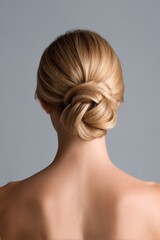 Fototapeta premium A woman with a bun hairstyle