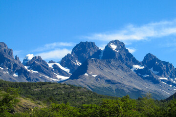 Obraz premium Torres del Paine national park in Patagonia Andes, Chile. South America mountain landscape. Beautiful mountains Torres del Paine on sunny day clear sky at sunrise. Glacier Grey from Paso John Gardner