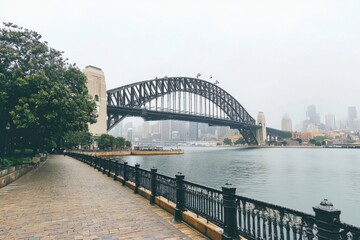 Fototapeta premium Majestic metal bridge spanning sydney river urban landscape architectural marvel foggy surroundings wide angle perspective captivating beauty
