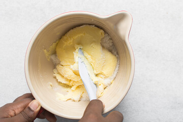 Top view of Creaming butter and sugar with a spatula, the process of making a cake or cookie
