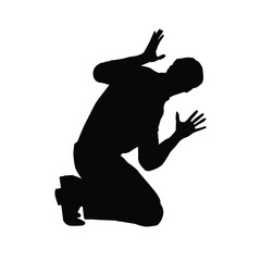 Silhouette of a man kneeling with hands raised in fear or panic, showing shock or defensive action