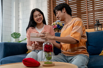 Asian beautiful woman receive birthday present gift box from boyfriend. 