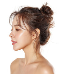 Side Profile of a Young Woman with Glowing Skin and Hair in a Bun