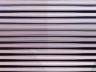 Obraz premium An abstract array of horizontal bands presents a rhythm of light and shadow. The interplay of colors creates an interesting background or texture for projects and designs, versatile and evocative.