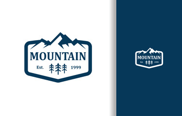 A LOGO OF MOUNTAIN SILHOUETTE WITH TREE AND FRAME IN BLUE COLOR FOR NATURE COMPANY