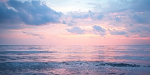 Obraz premium A dreamy horizon where soft pastel skies meet the calm ocean in a tranquil scene