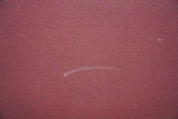Detailed close-up showcasing a red, coarse texture with subtle tonal variations, perfect for...