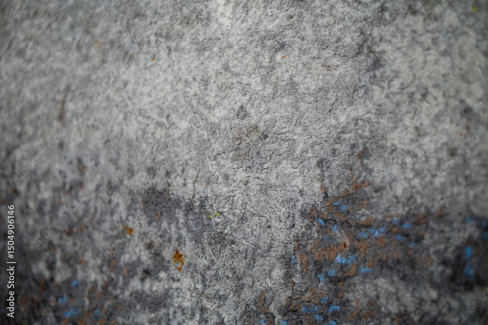 Poster abstract background showcases a textured, grey surface with subtle variations in tone, adding depth 