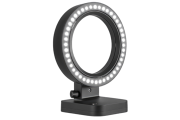 A circular LED ring light on a small, square base, emitting bright white light.  The device appears portable and lightweight
