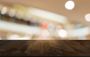 Empty wood table top and blur of restaurant background selective focus product display