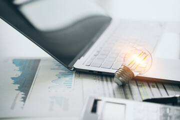 Bright Idea for Business Planning with Laptop and Calculator