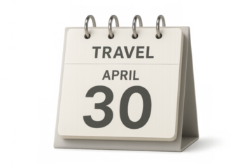 Desktop calendar displaying april 30th with the word travel on top, suggesting travel arrangements and planning