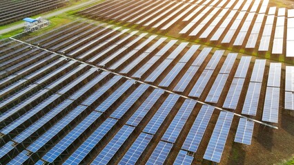 An aerial view showcases rows of solar panels, symbolizing the shift toward clean, solar-powered energy systems that support environmental conservation and reduce carbon footprints.
