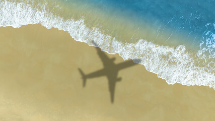 Aerial view of shadow passenger plane silhouette and sandy beach blue sea with waves at sea beach summer vacation sea travel concept	