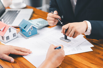Bank approve loan to buy home concept. Real estate agent talked about terms of home purchase...