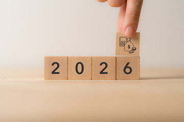 2026 Budget and financial planning strategy concept. Wooden blocks with the icons related to budgeting, investment and financial strategy. Strategy for efficient budget allocation, budget management.